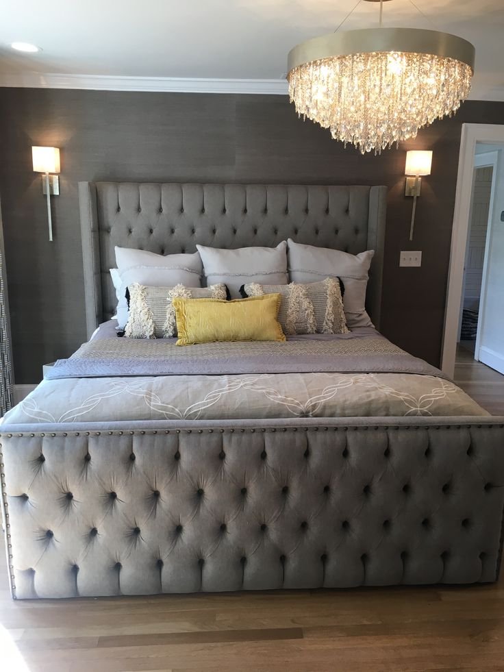 Handcrafted upholstered bed in a luxury bedroom setting
